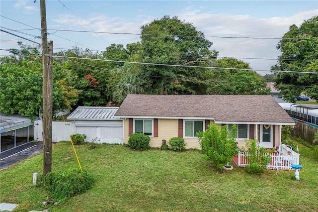 ranch-style home with a front yard and a carport