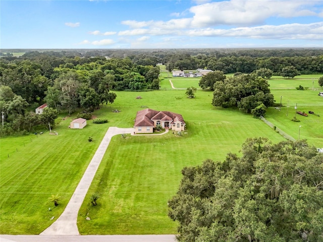 birds eye view of property with a rural view