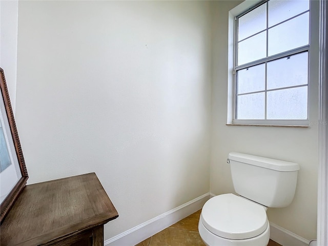 bathroom with tile patterned floors and toilet