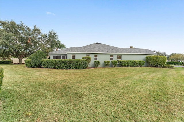 single story home with a front yard