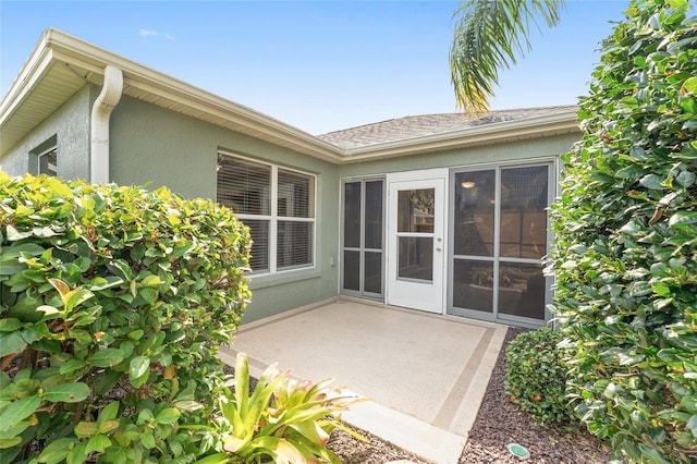 back of property with a patio