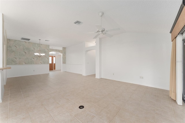 spare room with lofted ceiling, light tile patterned flooring, a textured ceiling, and ceiling fan with notable chandelier