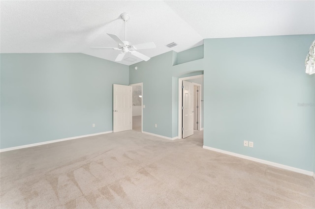 unfurnished bedroom with vaulted ceiling, light carpet, and ceiling fan