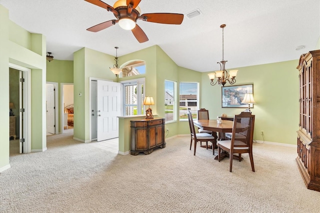 dining area with light carpet and ceiling fan with notable chandelier