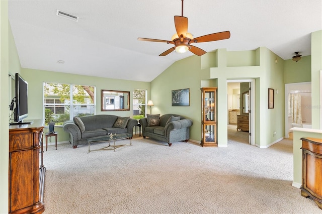 living room featuring ceiling fan, light colored carpet, and lofted ceiling