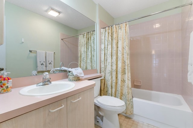 full bathroom featuring a textured ceiling, shower / bath combo, vanity, and toilet