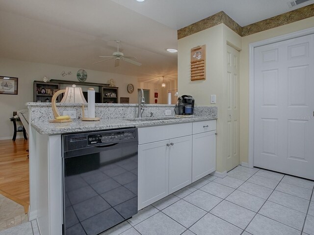 kitchen featuring light tile patterned floors, sink, ceiling fan, black dishwasher, and white cabinets