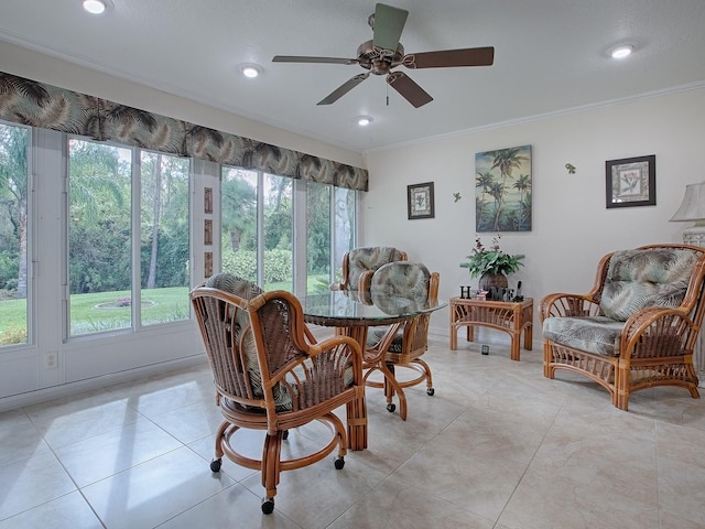 dining area featuring ornamental molding, light tile patterned floors, and ceiling fan