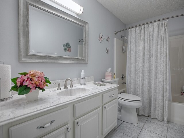 full bathroom with tile patterned flooring, toilet, shower / tub combo, vanity, and a textured ceiling