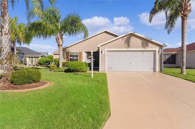 view of front of house with a garage and a front yard