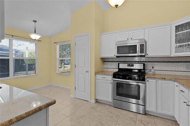 kitchen with white cabinetry, lofted ceiling, and appliances with stainless steel finishes