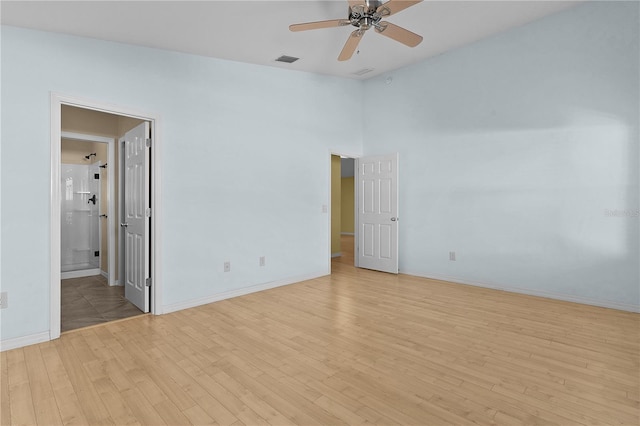 unfurnished room with light hardwood / wood-style floors and ceiling fan