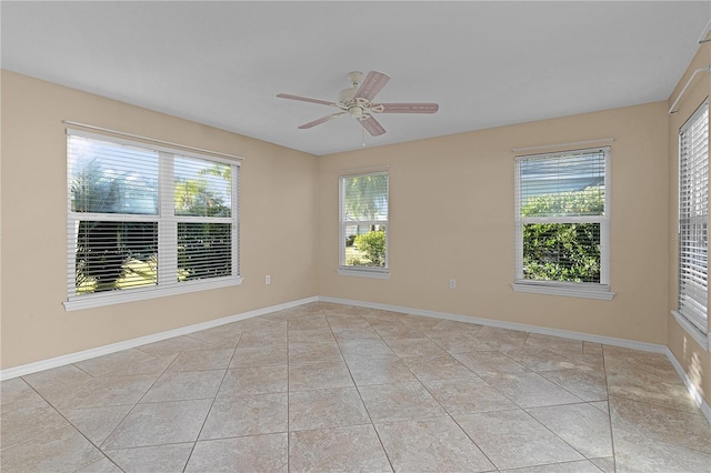 unfurnished room featuring ceiling fan and light tile patterned floors