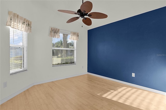 unfurnished room featuring wood-type flooring, ceiling fan, and lofted ceiling