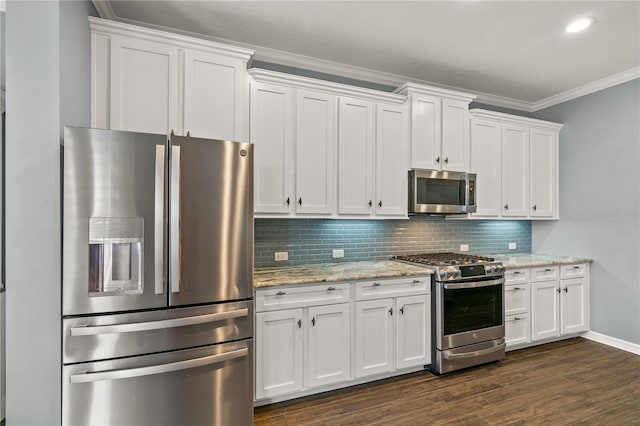 kitchen featuring white cabinets, backsplash, stainless steel appliances, crown molding, and dark hardwood / wood-style flooring