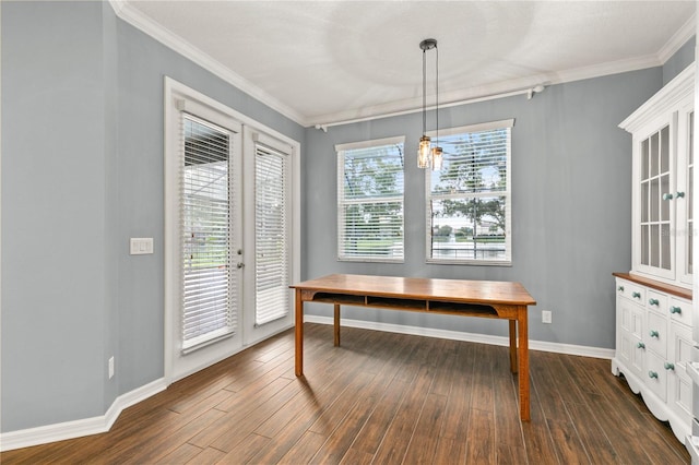 dining room featuring a healthy amount of sunlight, ornamental molding, and dark hardwood / wood-style floors