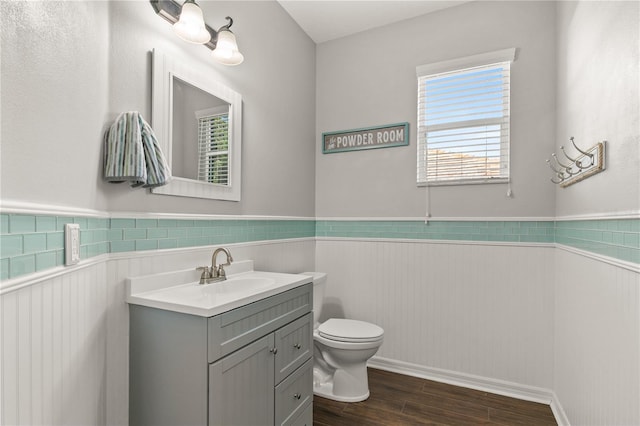 bathroom with vanity, hardwood / wood-style floors, and toilet