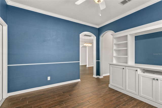 unfurnished room featuring a textured ceiling, crown molding, dark hardwood / wood-style flooring, and ceiling fan