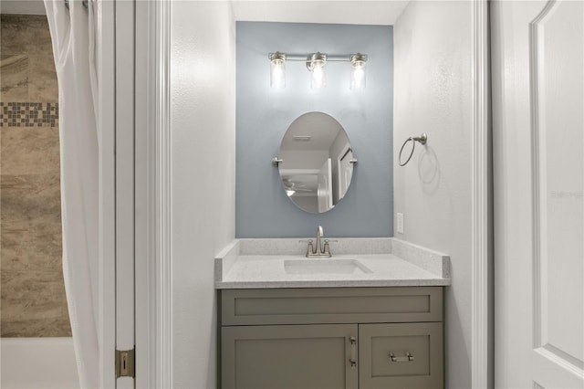 bathroom with vanity and a shower with shower curtain