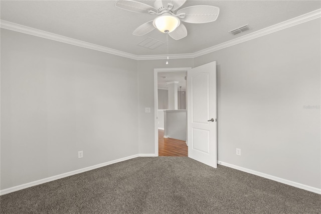 carpeted spare room featuring ornamental molding and ceiling fan