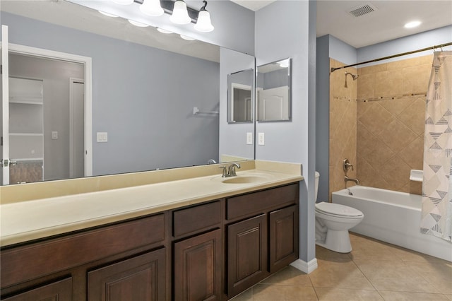 full bathroom with vanity, shower / bath combo with shower curtain, toilet, and tile patterned flooring