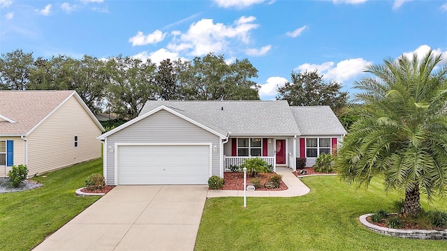 single story home with a garage, covered porch, and a front lawn