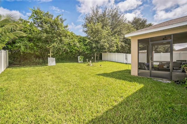 view of yard with a sunroom