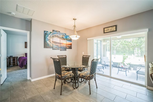 view of tiled dining space