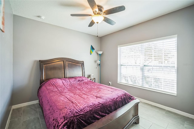 tiled bedroom with ceiling fan