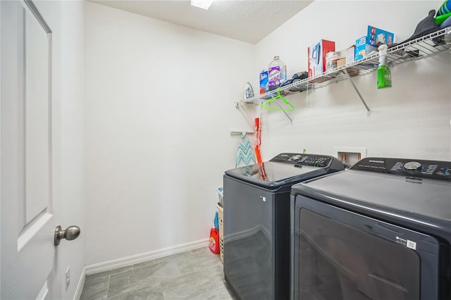 laundry room with independent washer and dryer