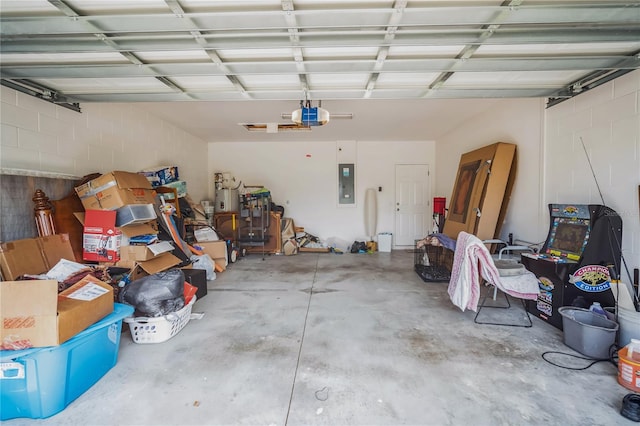 garage featuring electric panel and a garage door opener