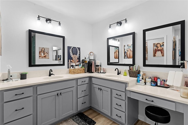 bathroom featuring vanity and hardwood / wood-style floors