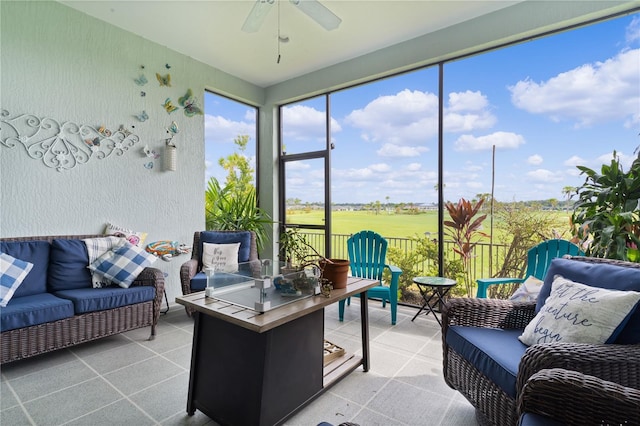 sunroom featuring ceiling fan