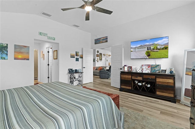 bedroom featuring vaulted ceiling, ceiling fan, and light hardwood / wood-style floors