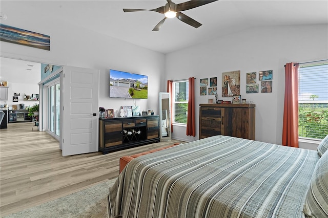 bedroom with light wood-type flooring, ceiling fan, and lofted ceiling