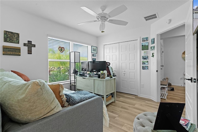 office area featuring ceiling fan and light wood-type flooring