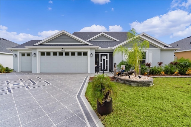 ranch-style home with a front yard and a garage