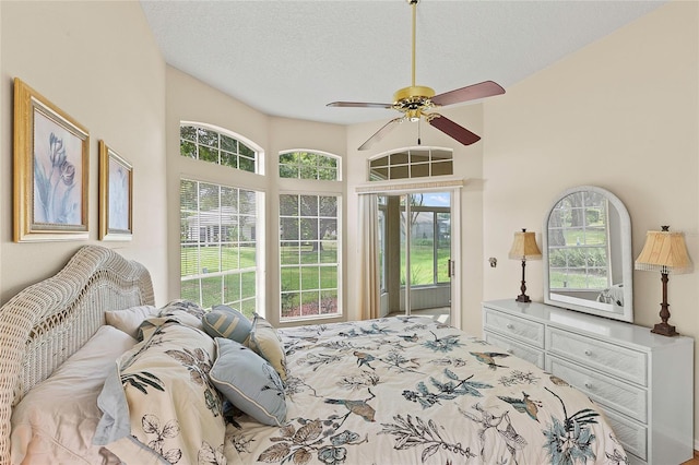 bedroom with a textured ceiling and ceiling fan