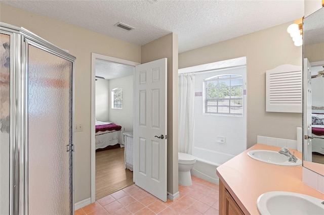 bathroom with a sink, visible vents, ensuite bathroom, and tile patterned floors