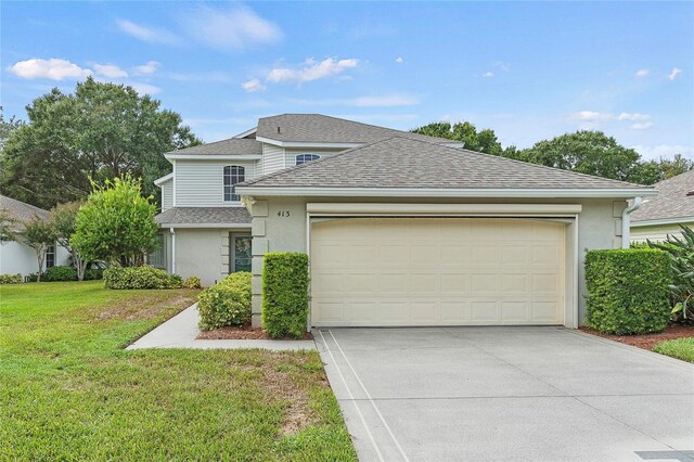 view of front facade featuring a garage and a front yard