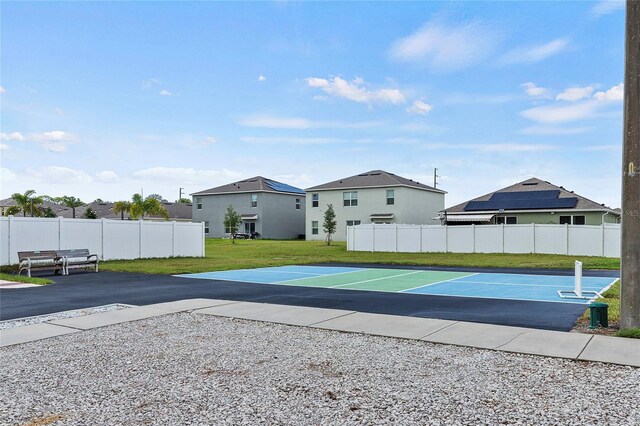 exterior space featuring a yard and tennis court