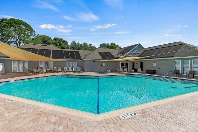 view of swimming pool with a patio area