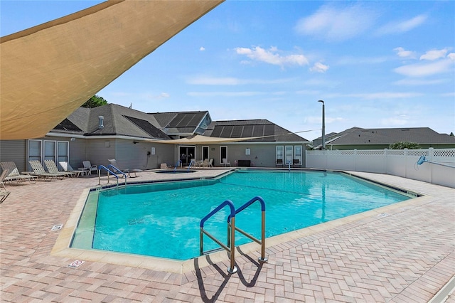 view of swimming pool featuring a patio area