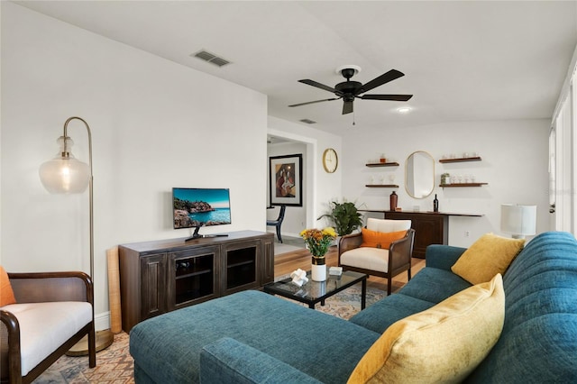 living room featuring ceiling fan and light hardwood / wood-style floors