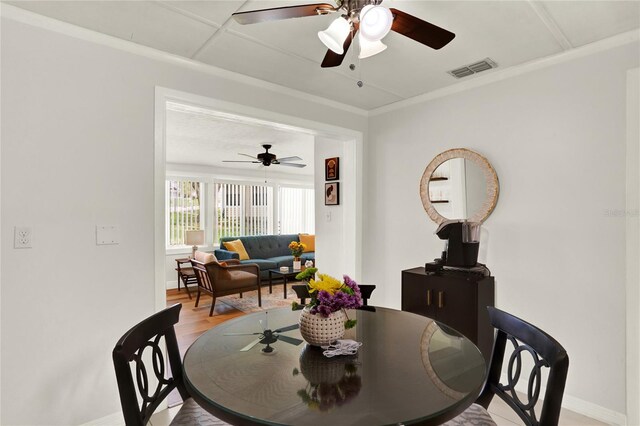 dining space featuring ceiling fan and light hardwood / wood-style floors