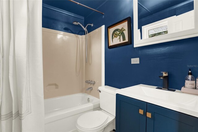 full bathroom featuring vanity, toilet, and shower / bath combo with shower curtain