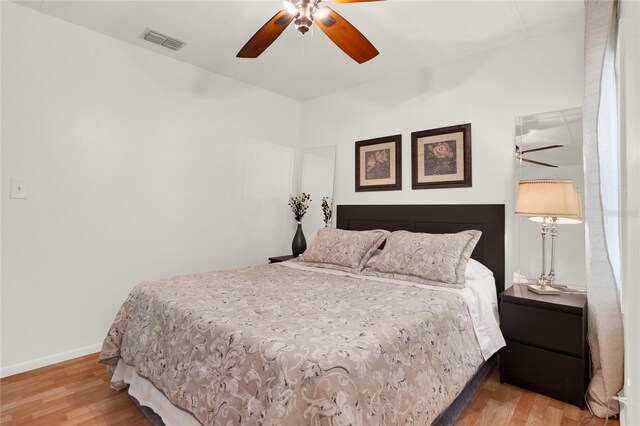 bedroom featuring light hardwood / wood-style flooring and ceiling fan