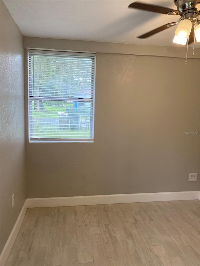 empty room featuring ceiling fan and wood-type flooring