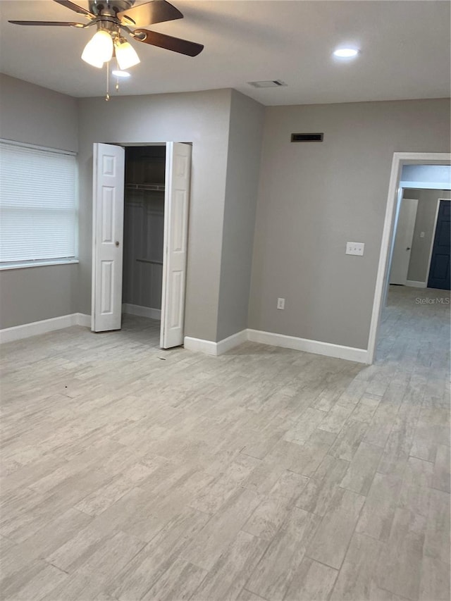 unfurnished bedroom featuring a closet, ceiling fan, and light hardwood / wood-style floors