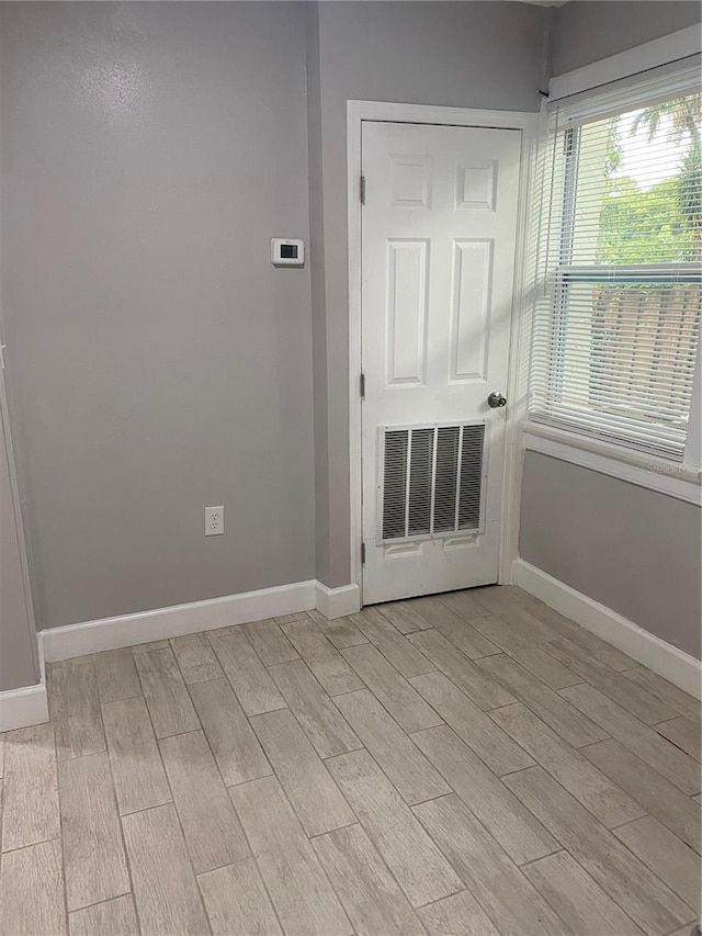 unfurnished room featuring light hardwood / wood-style floors